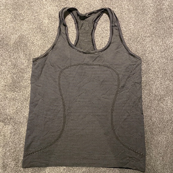 Lululemon black and white striped swiftly tank top. Size 12. EUC.